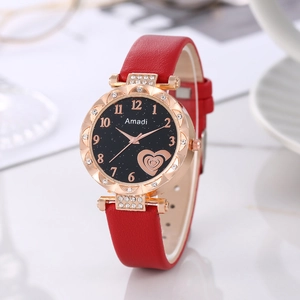 Close-up of Amadi quartz watch with red leather strap and sparkling heart star dial