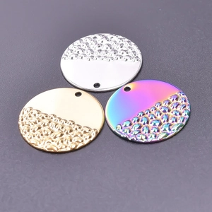 Detailed view of round metal pendants in silver, gold, and rainbow finishes for jewelry DIY