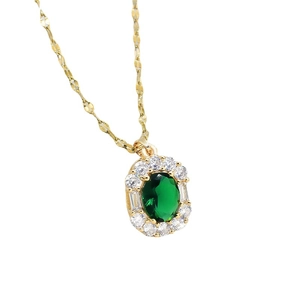 Vintage gold titanium necklace with emerald oval pendant and sparkling zircon halo inlay