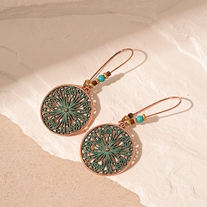 Vintage bohemian bronze drop earrings with turquoise beads and hollow floral engraving