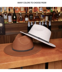 Detail of wool fedora hats with rivet bands on a rustic wooden bar counter