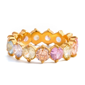 Detailed macro view of 18K gold eternity band featuring round-cut colorful gemstones
