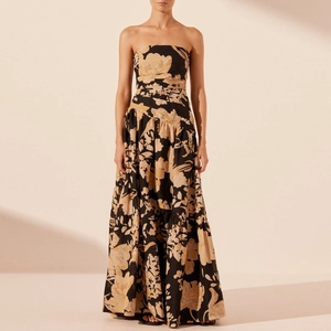 Floral strapless maxi dress with a fitted waist and tiered skirt in black and beige