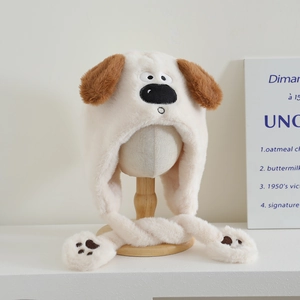 Close-up of soft plush puppy earflap hat with cute brown ears and paw prints detail