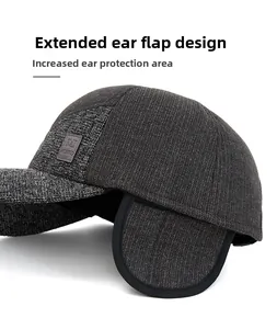 Detailed view of the winter baseball cap with extended earflaps and textured tweed fabric