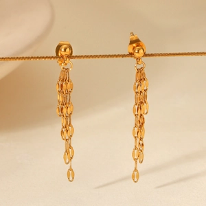 Macro shot of 18k gold plated long multi-chain tassel drop earrings with rounded studs