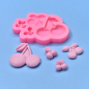 Pink silicone cherry mold set with five cavities for fondant or clay modeling