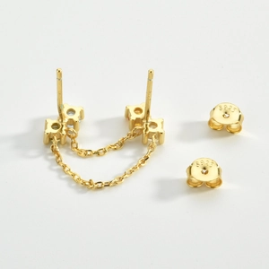 Close-up of S925 sterling silver stamp on golden chain link double stud earrings
