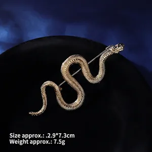Detailed view of vintage gold snake brooch showing texture, 2.9x7.3cm size and 7.5g weight