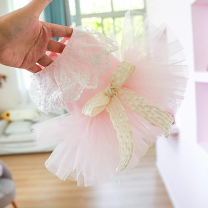 Pink lace pet dress for dogs and cats featuring layered mesh skirt and large bow decor