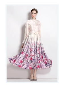 Detail of elegant satin print dress with high collar, lantern sleeves and waist tie belt