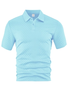 Close-up of light blue polo shirt with textured diamond jacquard fabric and collar detail