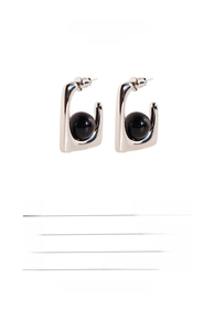 Detailed spec view of geometric square black agate earrings with 925 silver needles