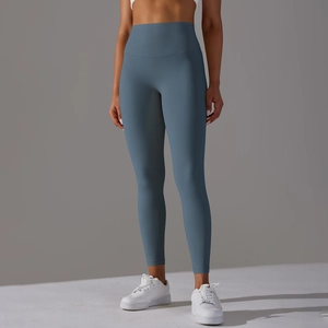 Detail view of high waisted yoga leggings in dusty blue with seamless waist design