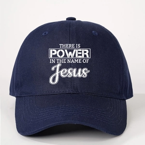 Dark blue adjustable baseball cap with white Power in the Name of Jesus print on front