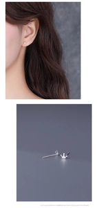 Detail showing sterling silver crown earrings on ear and macro texture view