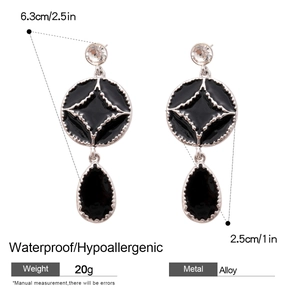 Detailed size and material guide for black enamel star earrings in silver finish