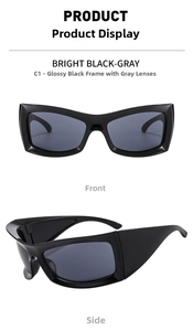 Close-up of futuristic sports sunglasses with shiny black frames and grey lenses