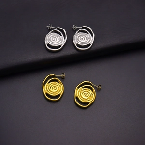 Exaggerated 18k gold spiral swirl earrings in silver and gold stainless steel finish
