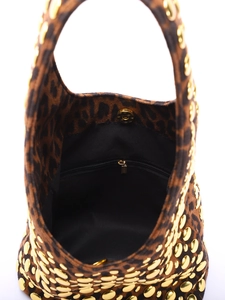Detail view of leopard print bag featuring gold rivets and magnetic closure interior