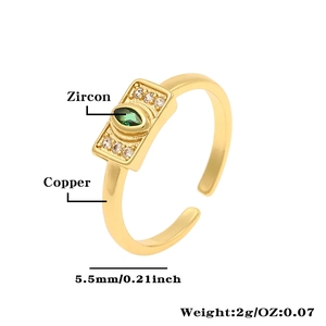 Detail view of 18K gold plated copper ring featuring rectangular green zircon stone