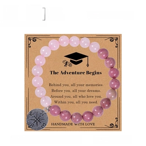 Natural rose quartz compass bracelet on graduation gift card with specifications
