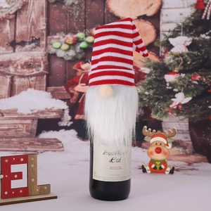Christmas forest gnome wine bottle cover with red and white striped knit hat and long beard