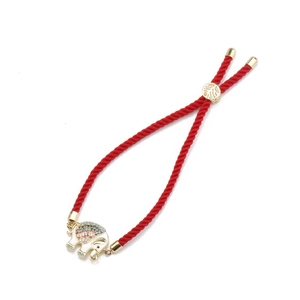 Adjustable red rope bracelet with a gold elephant pendant and colorful cubic zirconia