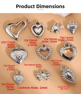Detailed view of silver Y2K heart pendants with assorted vintage metal charm designs