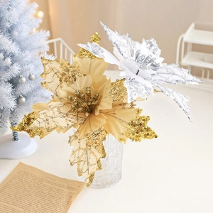 Close-up of golden and silver Christmas artificial flowers with sequins for tree decor