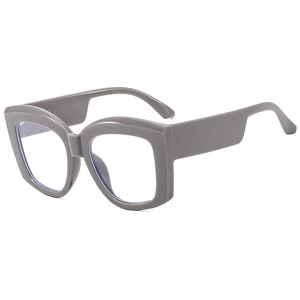 Occhiali grigi oversize anti-luce blu con stanghette spesse e stile moderno minimalista