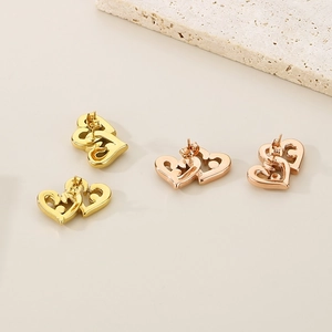 Minimalist 18K gold and rose gold heart stud earrings in hollow double-heart design
