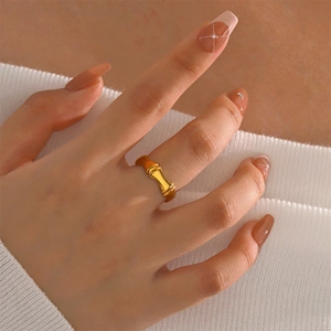 Minimalist golden bamboo joint ring for women in polished stainless steel finish