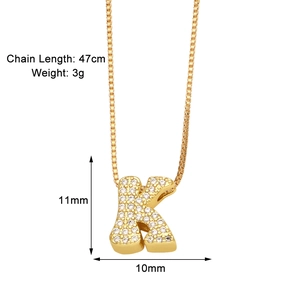 Detail view of gold letter K necklace with zircon inlay and measurement parameters