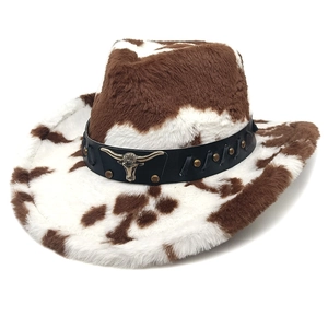 Cow print faux fur cowboy hat featuring a leather band with bull head metal emblem