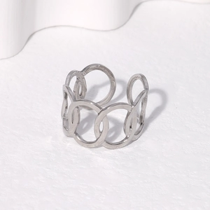Minimalist silver chain link open ring design on white textured background
