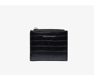 Detailed view of black crocodile pattern PU leather surface with gold zipper and logo