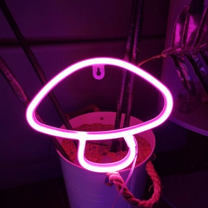 Detailed view of pink mushroom LED neon sign with a convenient hanging hole for wall decor