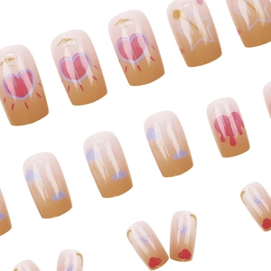 Hand-painted press-on nails set with heart and star patterns in gradient colors