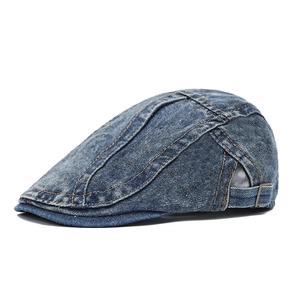 Classic washed blue denim newsboy cap with vintage distressed texture and metal buckle