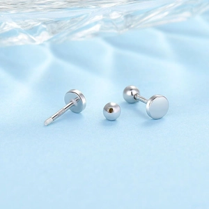 Detailed macro view of S999 sterling silver hallmark on silver round stud earrings