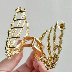 Gothic gold skeleton rib cage hair claw clip with spider web design for Halloween hair