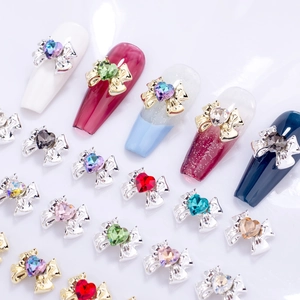 Macro shot of colorful heart rhinestone alloy bow nail art charms in various vibrant colors
