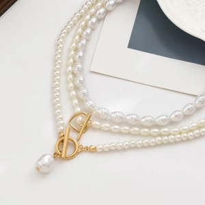 Close-up of Baroque pearl necklace with irregular pearls and a golden toggle clasp