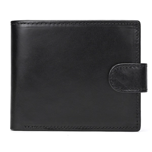 Detail shot of black leather wallet showing fine stitching and snap fastener texture