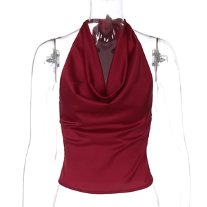 Detail of burgundy satin halter top showing smooth fabric texture and glossy finish