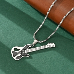 Hip hop style silver necklace with black and white bass guitar pendant on green texture