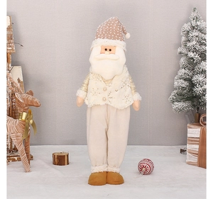 Detail of plush Santa Claus figure with beige snowflake knit hat and white embroidered vest