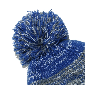 Detail of kids' knitted hat featuring a large blue and grey fluffy pom-pom top
