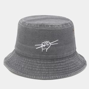 Detail of stone washed gray bucket hat with white embroidery and metal eyelets